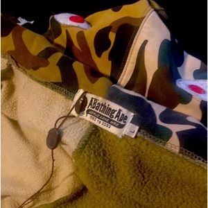 It is a green and tan bape jacket.